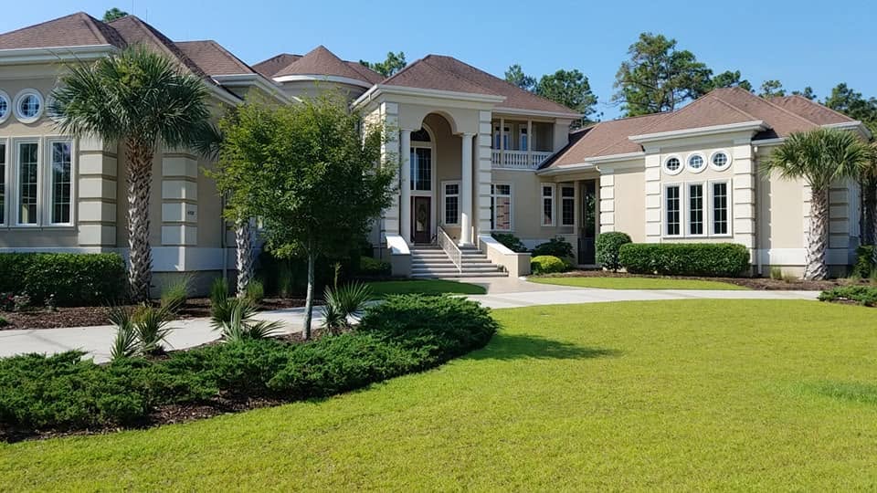 Green lawn in front of a residential home
